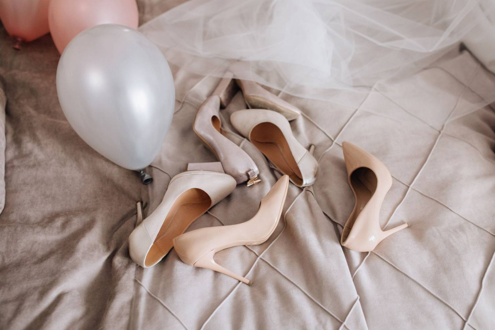 Beige shoes are lying blanket near veil balloons wp